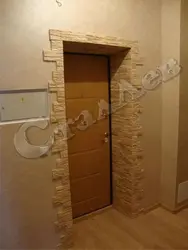 Door in the hallway made of stone photo