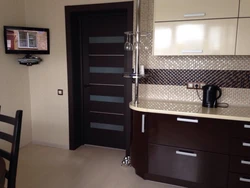 Kitchen interior with dark doors