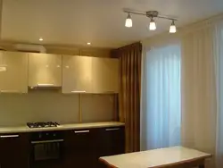 What color are the curtains for a beige kitchen photo