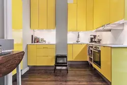 What colors does yellow go with in the kitchen interior?