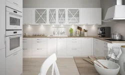 Kitchen with white appliances in the interior photo