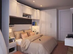 Маленькая спальня с кроватью и шкафом фото