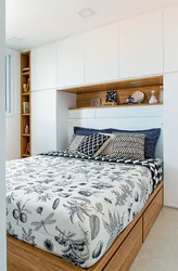 Small bedroom with bed and wardrobe photo