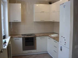 Brezhnevka kitchen design with refrigerator photo