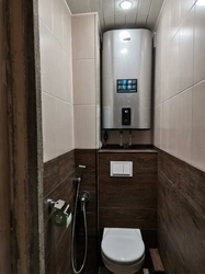 Design of a small toilet in an apartment with a water heater