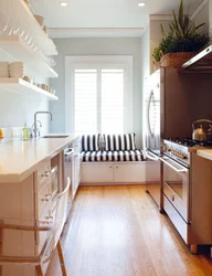 Design of a narrow kitchen in a house with a window