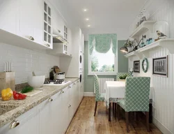 Design of a narrow kitchen in a house with a window