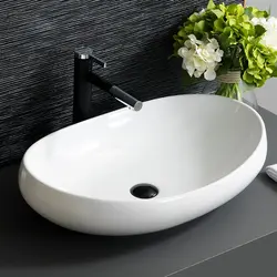 Photo of a bathtub with a bowl sink