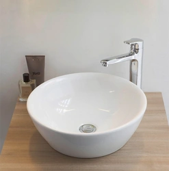 Photo Of A Bathtub With A Bowl Sink