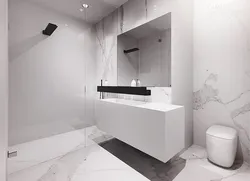 Ақ мәрмәрден жасалған ванна бөлмесінің интерьері