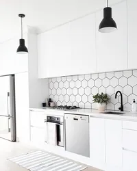 Photo of white tiles with black grout in the bathroom