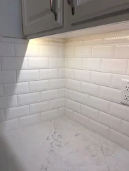 Photo Of White Tiles With Black Grout In The Bathroom