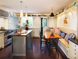 Photo of a modern style kitchen with a sofa