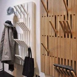 Clothes hangers in the hallway made of wood photo