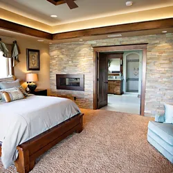 Bedroom Design With Stone On The Wall