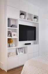 TV built into the closet in the bedroom photo