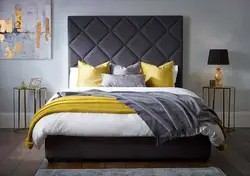 Gray Bed With A Soft Headboard In The Bedroom Interior Photo