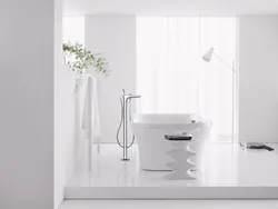 White faucets in the bathroom interior