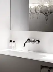 White faucets in the bathroom interior
