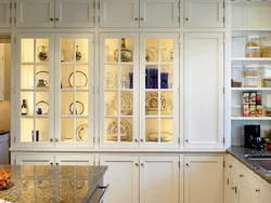 Glass cabinets in the kitchen interior photo