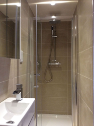 Shower cabin in a small bathroom without toilet photo