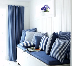 Living room with blue sofa and blue curtains photo