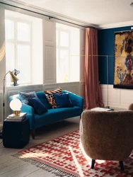 Living room with blue sofa and blue curtains photo
