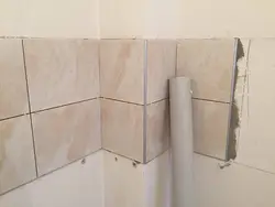 Photo of corner of bathtub tiles