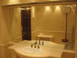 Bath interior with large mirror