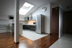 Laminate in the living room and tiles in the kitchen photo