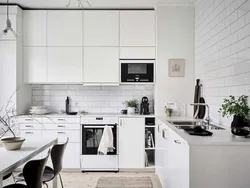 Белая кухня черная техника в интерьере