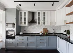 Gray kitchen with black countertop and apron in the interior