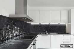 Gray kitchen with black countertop and apron in the interior