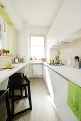 Design Of A Narrow Kitchen With A Window On The Entire Wall