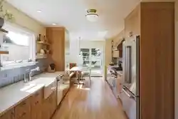 Design Of A Narrow Kitchen With A Window On The Entire Wall