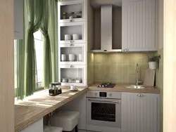 Interior of a small kitchen with a refrigerator photo