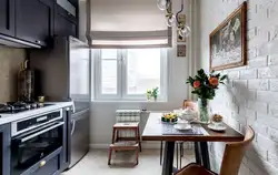 Interior of a small kitchen with a refrigerator photo