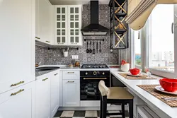 Interior Of A Small Kitchen With A Refrigerator Photo