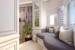 Photo of the design of a one-room apartment with a loggia