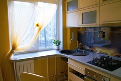 Kitchen design in Khrushchev with a window sill and countertop