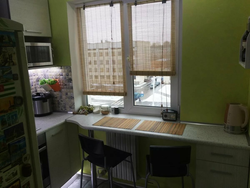 Kitchen design in Khrushchev with a window sill and countertop