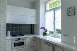 Kitchen design in Khrushchev with a window sill and countertop