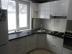 Kitchen design in Khrushchev with a window sill and countertop