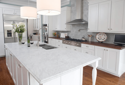 White Kitchen With Marble Countertop And Apron In The Interior