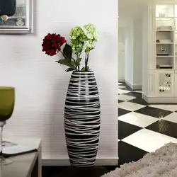 Vase in the living room interior with flowers photo