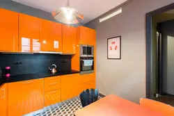 Orange wall in the kitchen interior