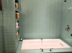 Bathtub made of cheap tiles photo