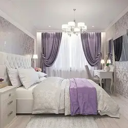 Living room with lilac curtains interior photo