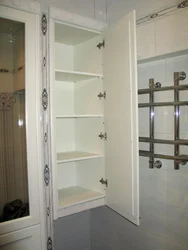 Photo of a bathroom cabinet up to the ceiling