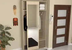 Wardrobe in a small hallway with a mirror photo